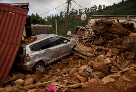 A home and a car destroyed by Cyclone Idai in Zimbabwe